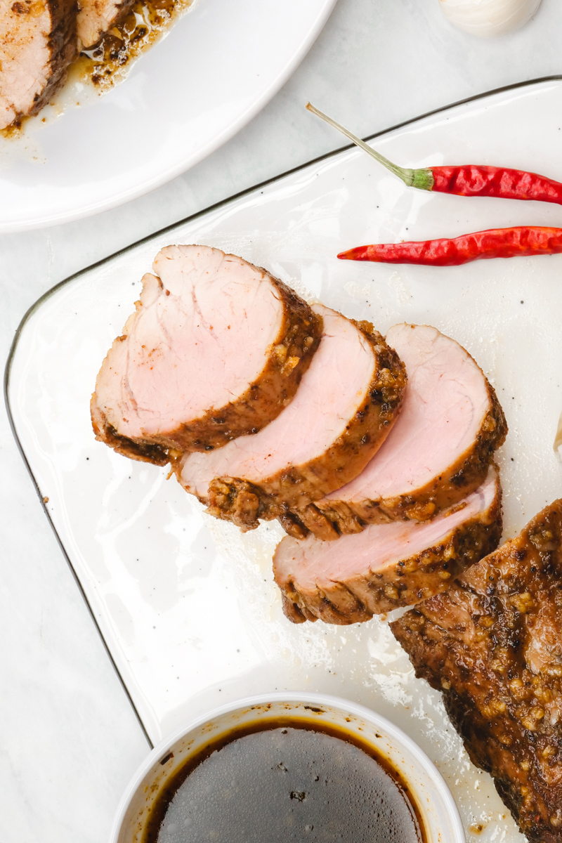 Island style baked pork tenderloin on a skillet