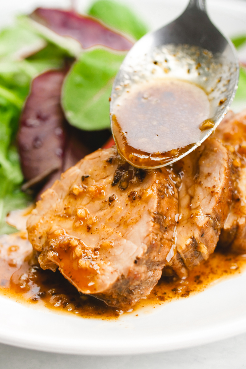 A delicious pork tenderloin, sauces with a tropical sauce