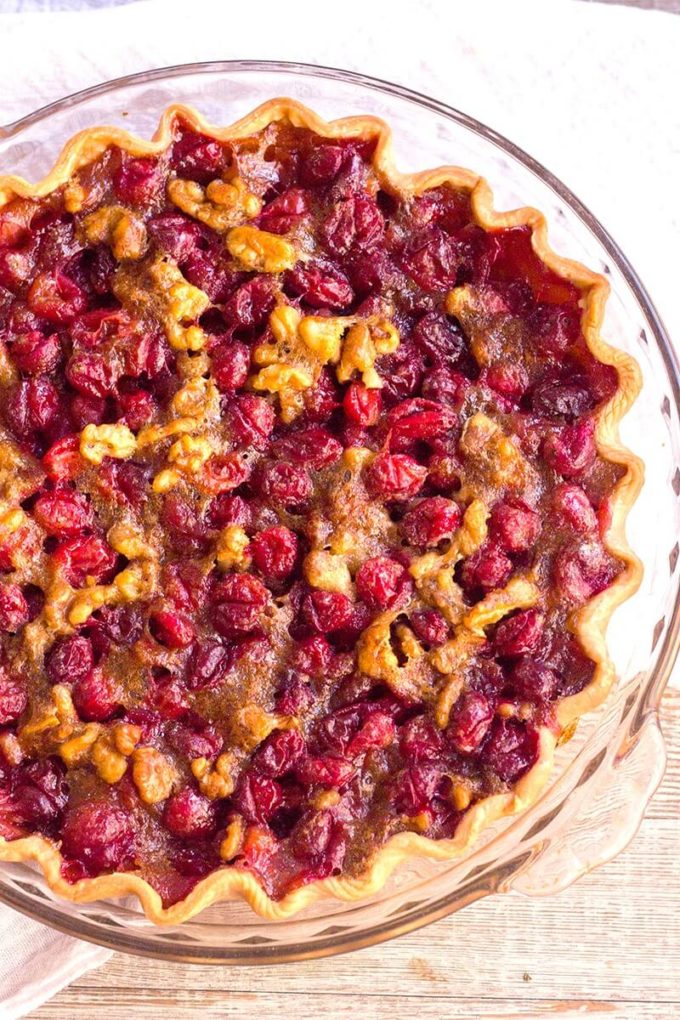 Cranberry Walnut Pie is a sweet, tart, and nutty pie that's a showstopping dessert for the holidays! Savor this pie as is, or top it with a scoop of vanilla ice cream for a treat you won't forget!