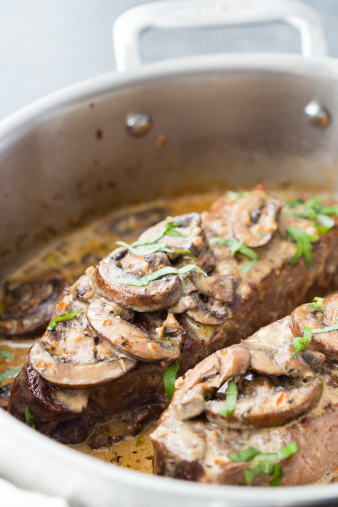 Garlic Parmesan Mushroom Cream Sauce on top of a delicious pan seared steak