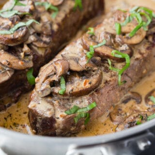 Garlic Parmesan Mushroom Cream Sauce on top of a delicious pan seared steak