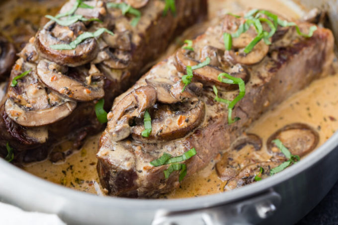 Garlic Parmesan Mushroom Cream Sauce on top of a delicious pan seared steak