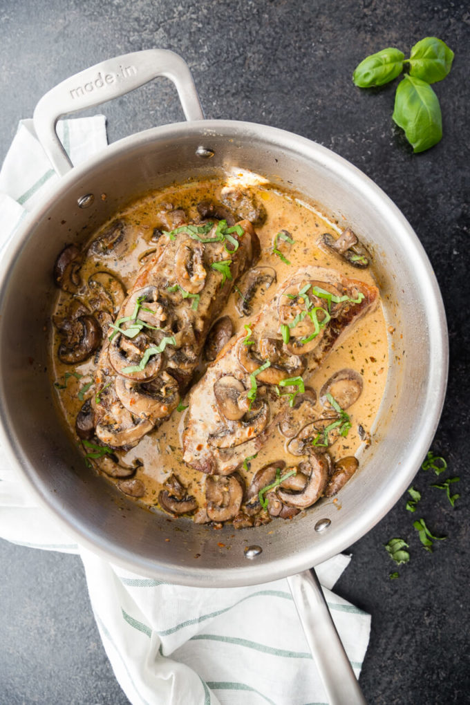 Garlic Parmesan Mushroom Cream Sauce on top of a delicious pan seared steak cooked in Made In Cookware