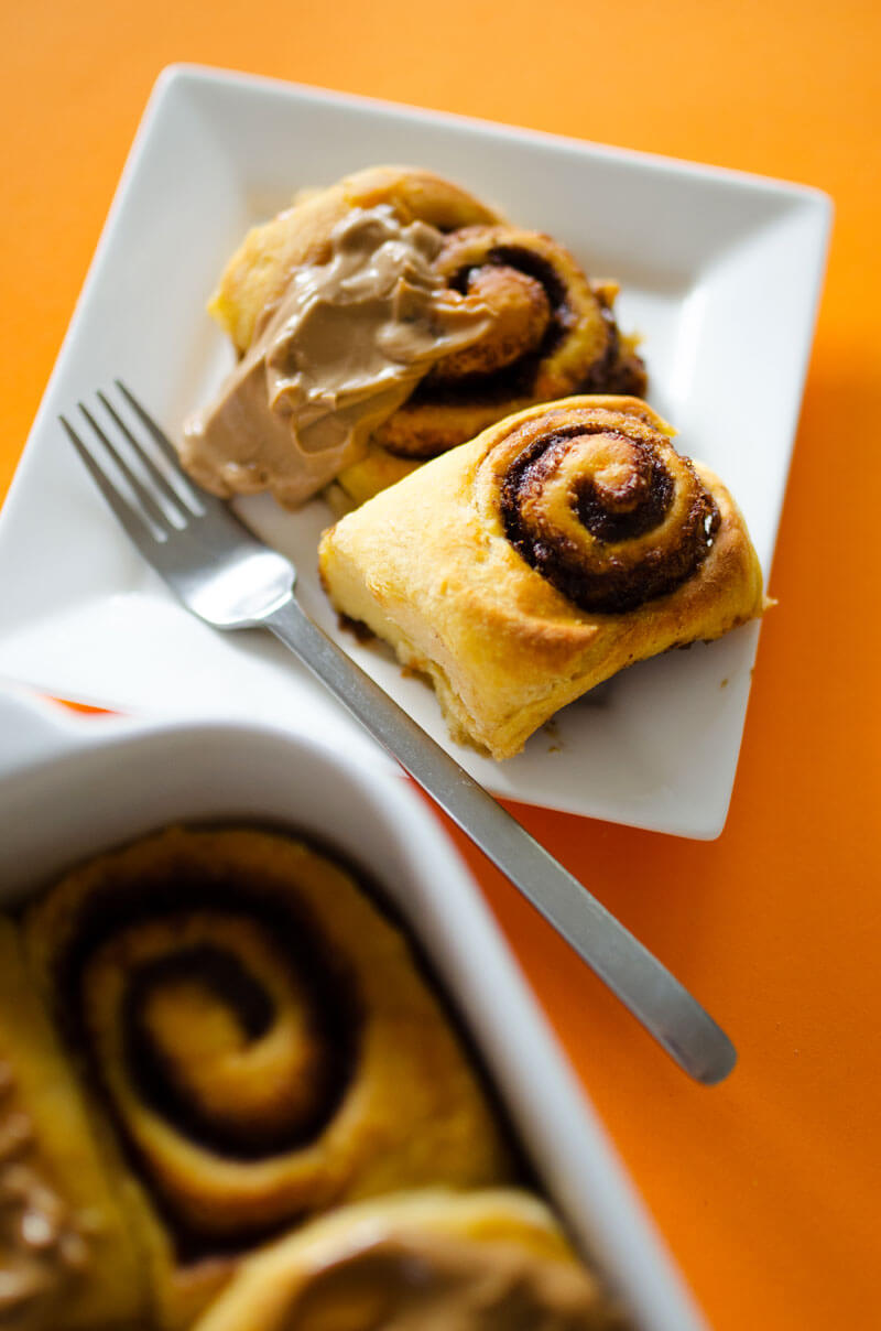 These Sweet Potato Cinnamon Rolls are decadent, fluffy, and slathered with a simple brown sugar frosting. Cozy up with a cup of tea and these cinnamon rolls for the perfect autumn morning!