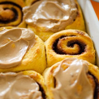 These Sweet Potato Cinnamon Rolls are decadent, fluffy, and slathered with a simple brown sugar frosting. Cozy up with a cup of tea and these cinnamon rolls for the perfect autumn morning!