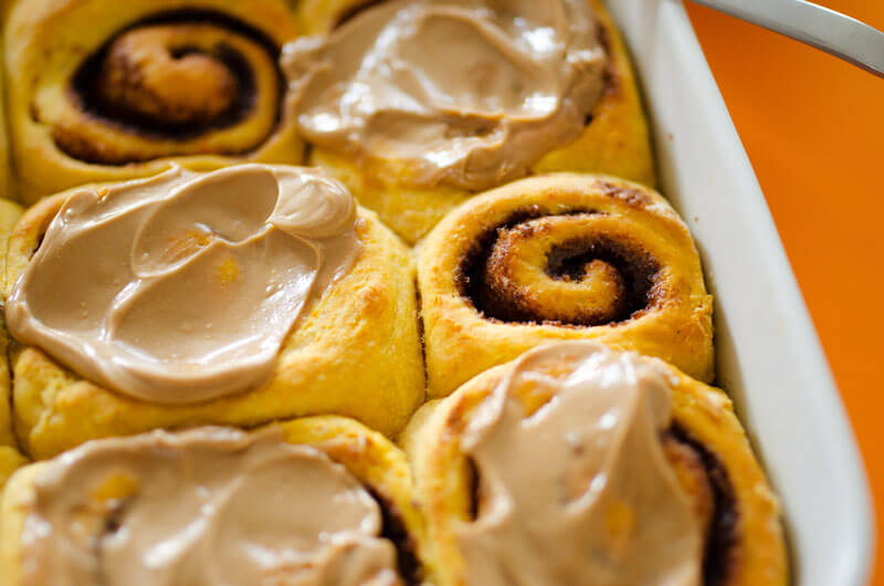 These Sweet Potato Cinnamon Rolls are decadent, fluffy, and slathered with a simple brown sugar frosting. Cozy up with a cup of tea and these cinnamon rolls for the perfect autumn morning!