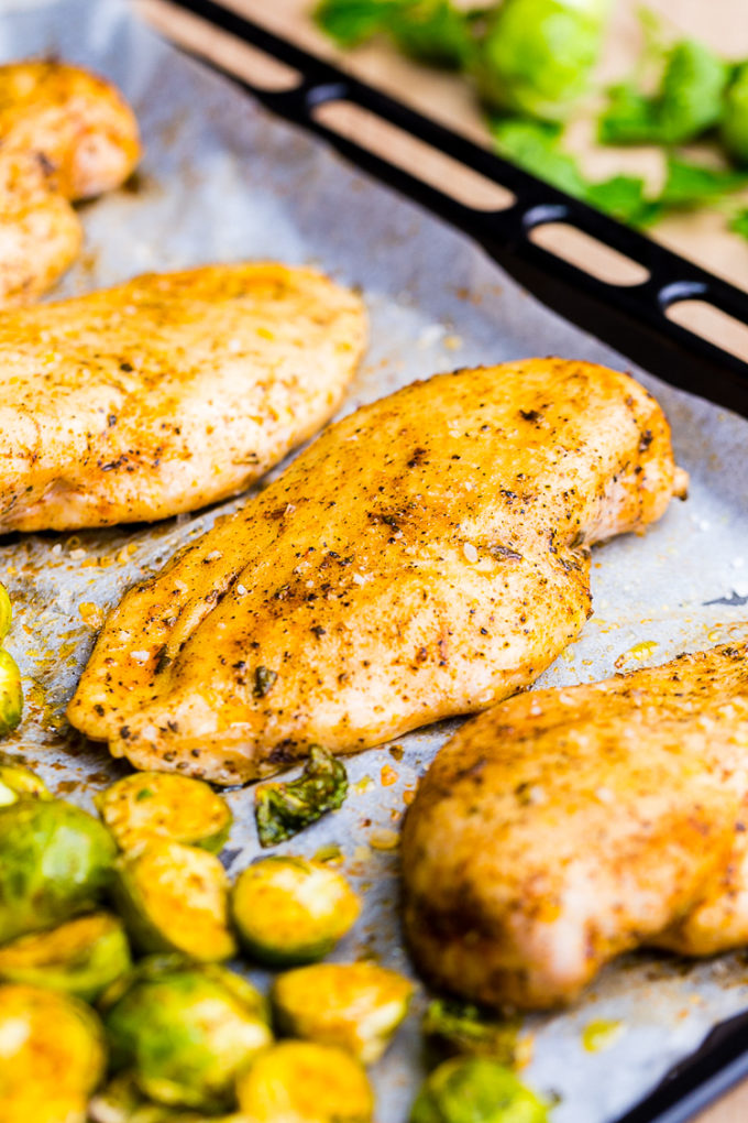 Making roasted Brussel sprouts with chicken for a complete meal