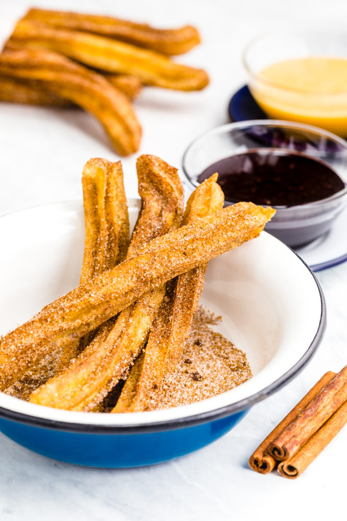 Churros- fried dough dipped in cinnamon and sugar and paired with caramel and chocolate dipping sauces
