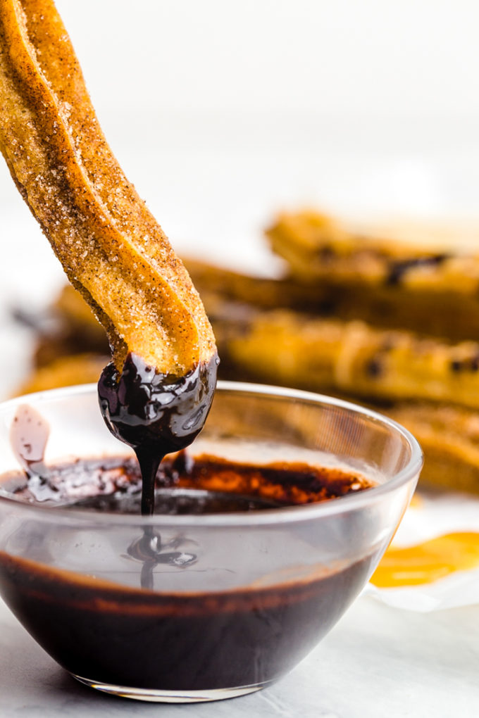 Easy to make churros dipped in a chocolate ganache sauce that is amazing