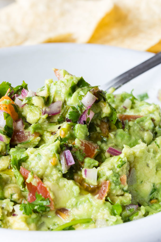 How to make delicious guacamole with fresh avocados and other fixings like cilantro, red onion, lime juice, etc. 