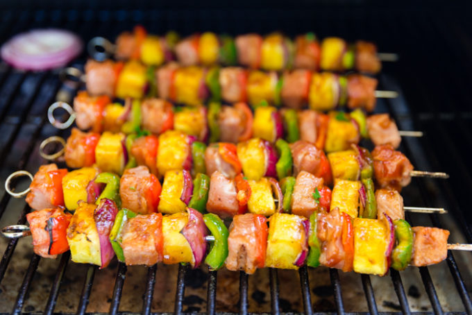 Cooking sticky bbq pork kabobs on the grill, 6 kabobs cooking