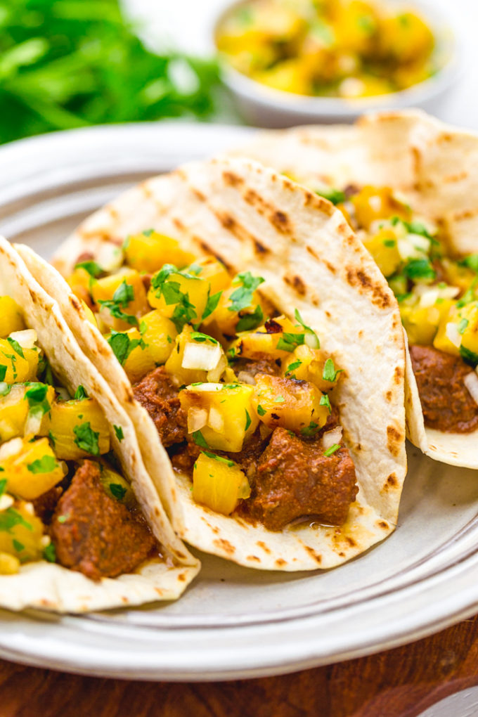 Tacos al pastor, richly flavorful pork al pastor tacos with a pineapple pico