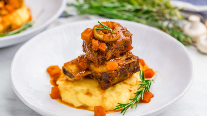 Braised short ribs, a great dinner option, served over polenta