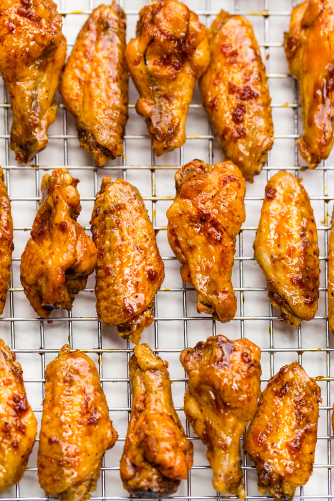 A big cooling rack covered in crispy baked chicken wings