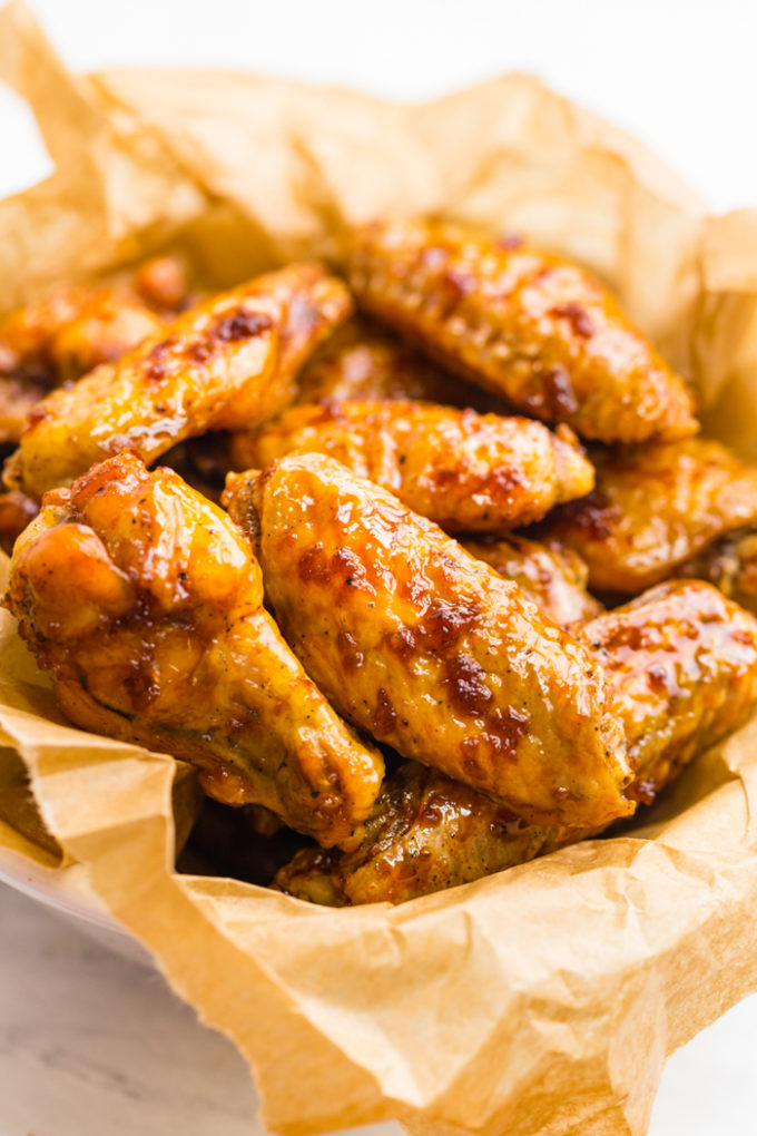 Crispy Baked chicken wings in a basket with butcher paper liner