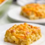 Mac and cheese casserole on a white plate