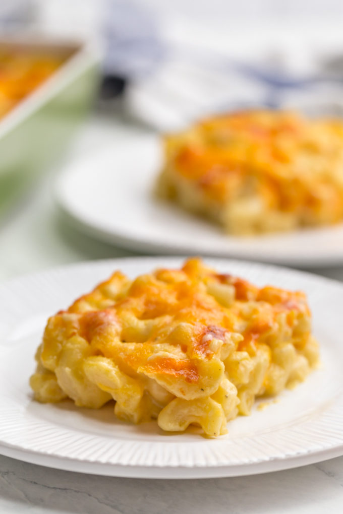 Mac and cheese casserole on a white plate