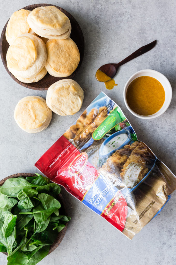Tyson crispy chicken strips, buttermilk biscuits, spinach, and honey mustard sauce
