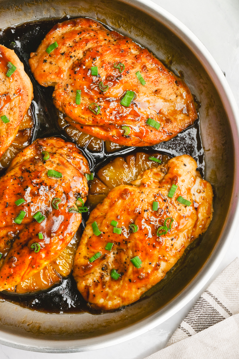 Easy teriyaki chicken, garnished with green onion. In a skillet. 