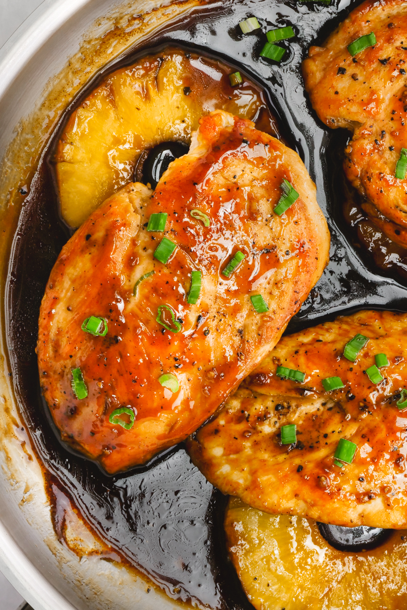 Skillet teriyaki chicken, a delicious chicken breast, cooked in homemade teriyaki sauce, served over pineapple rings. Made stovetop. 