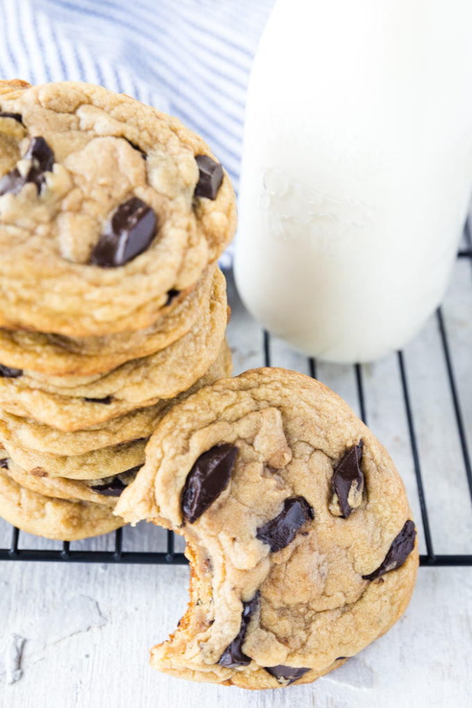 Traeger smoked chocolate chip cookies, with some milk and a cooling rack