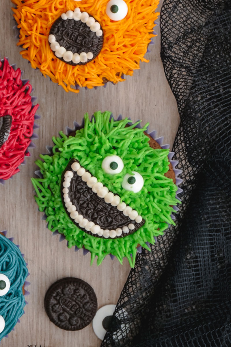 A green monster cupcake with an OREO mouth