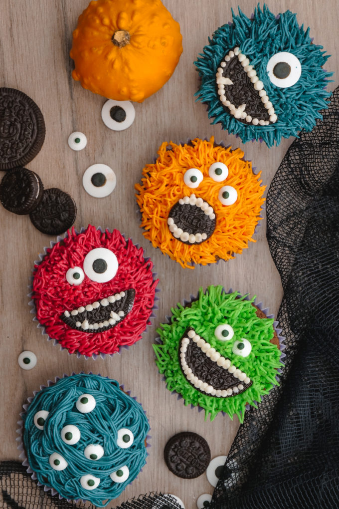 Monster Halloween Cupcakes- Grass icing tip, colored frosting, eye balls, and OREO cookies