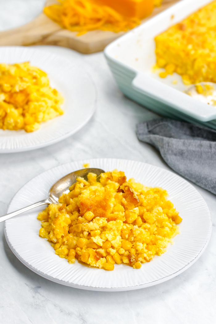 Corn casserole in a square casserole dish, this spoon bread is sweet and tasty. 