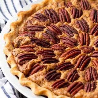 Easy, delicious, pecan pie, with a striped napkin next to it