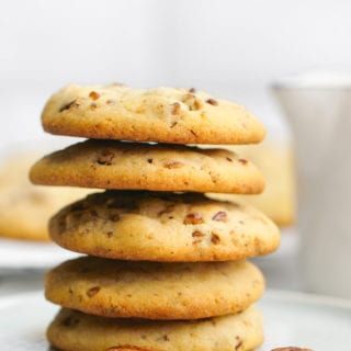 A plate stacked with homemade pecan sandies cookies