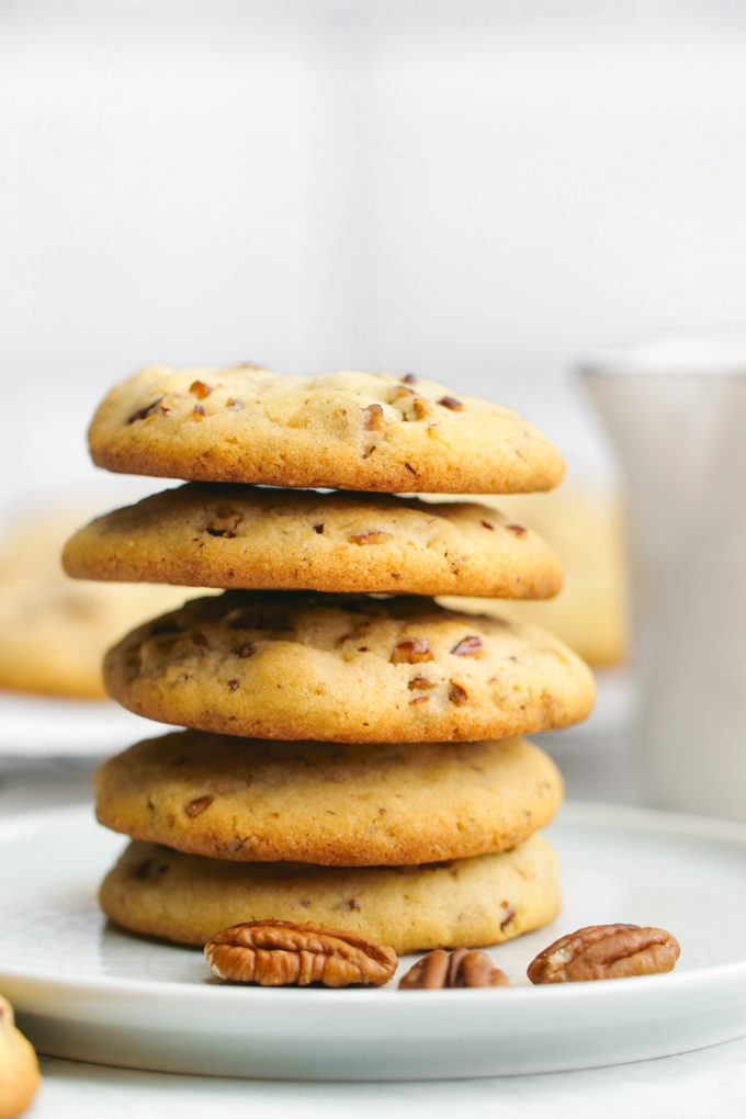 A plate stacked with homemade pecan sandies cookies