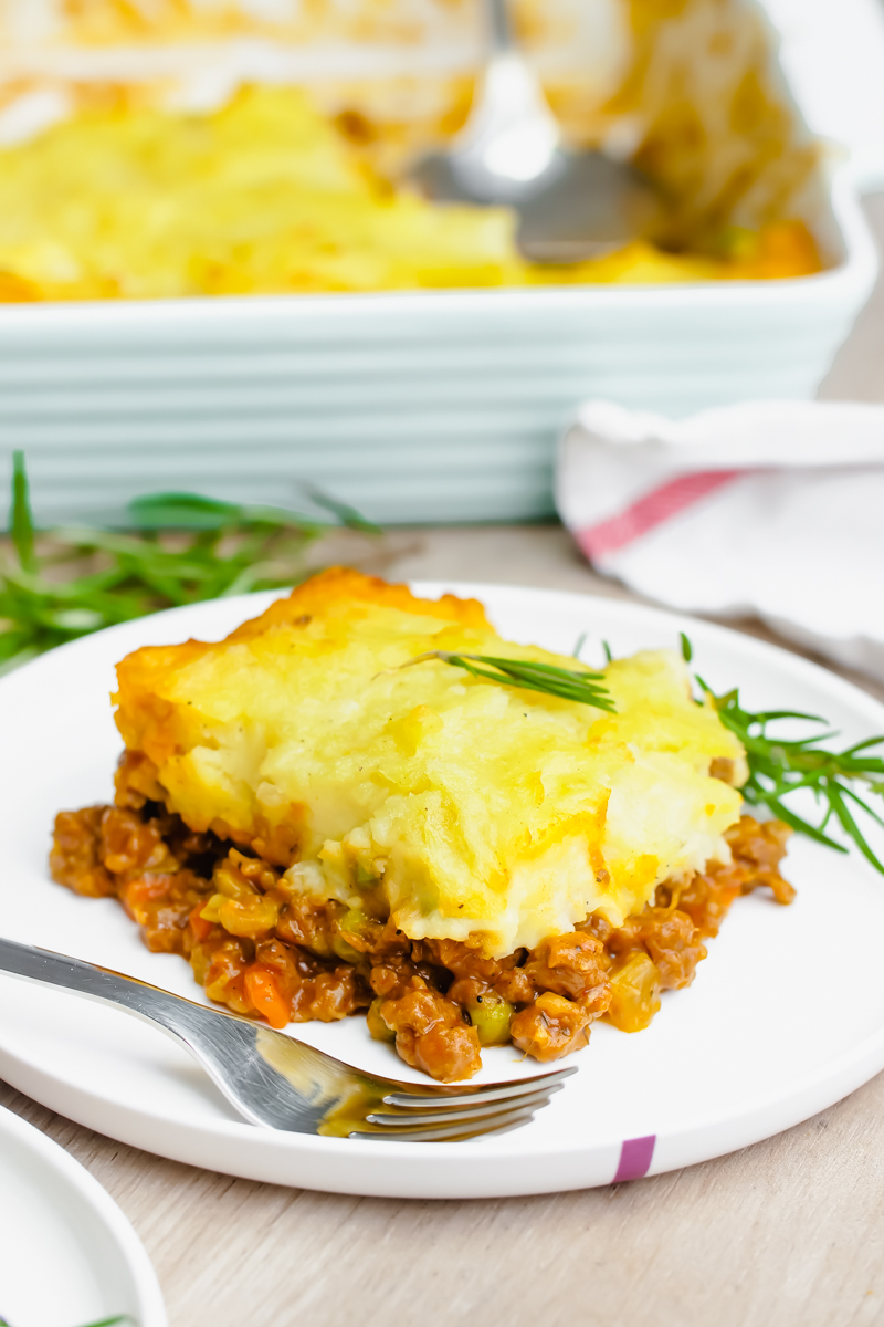Easy Shepherd's Pie- A delicious shepherd's pie recipe complete with ground lamb or beef, and topped with mashed potatoes and butter