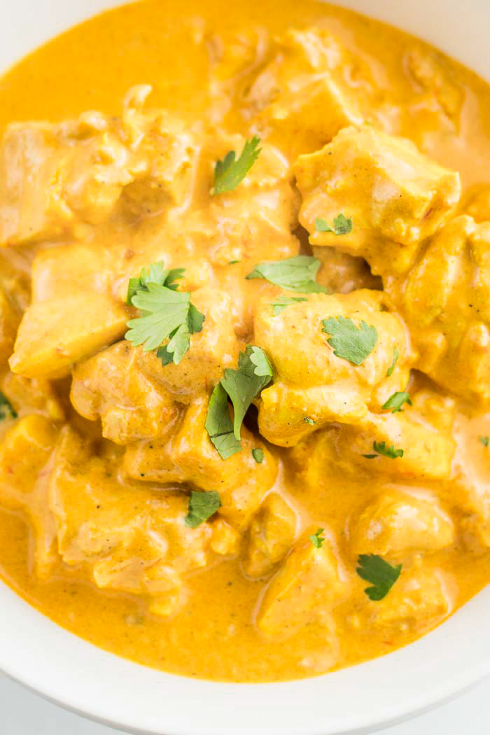 Indian butter chicken, garnished with fresh cilantro