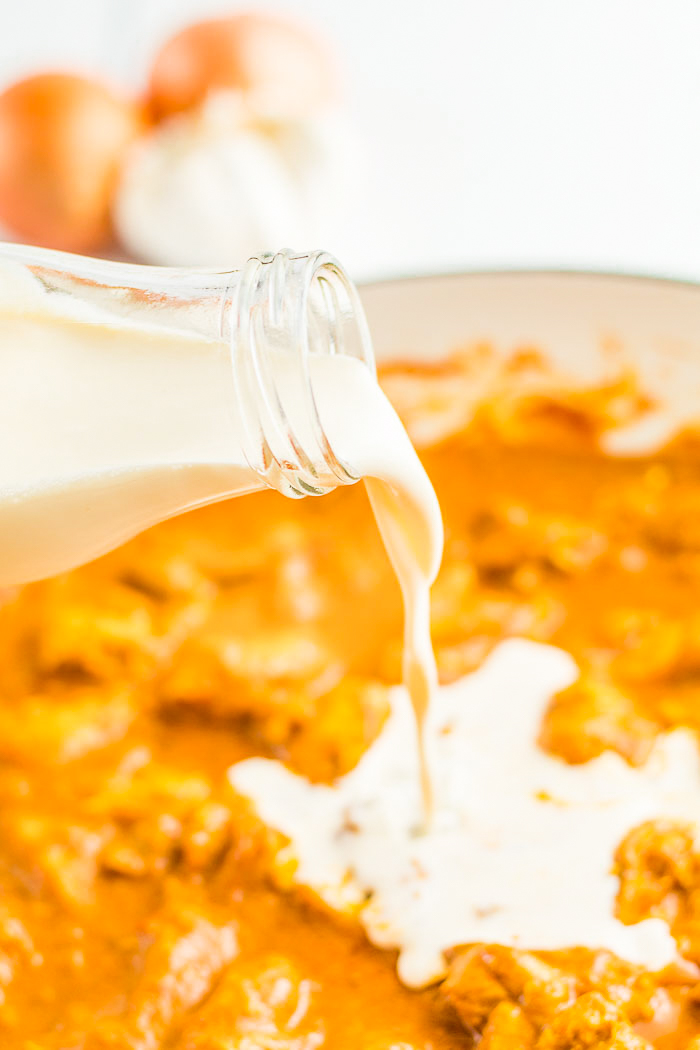 Adding cream to the butter chicken recipe