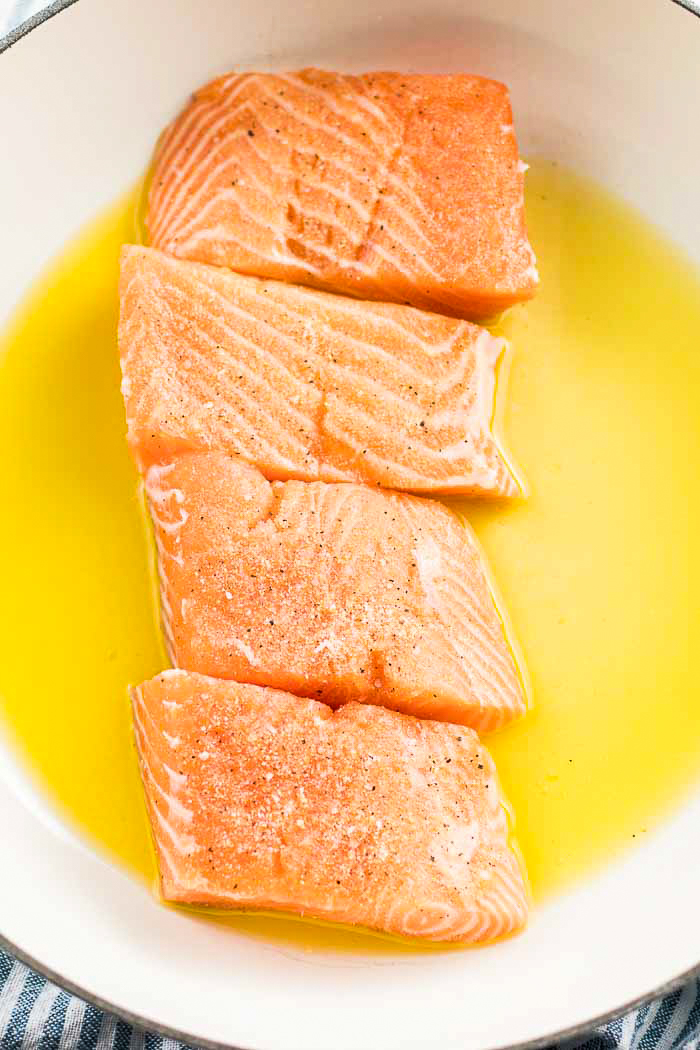 Step two for this salmon recipe is adding in your seasoned salmon fillets