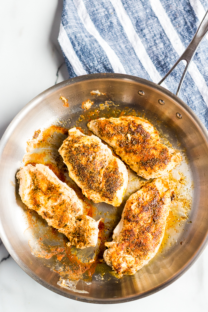 creamy lemon chicken with asparagus, four pieces of seared chicken 