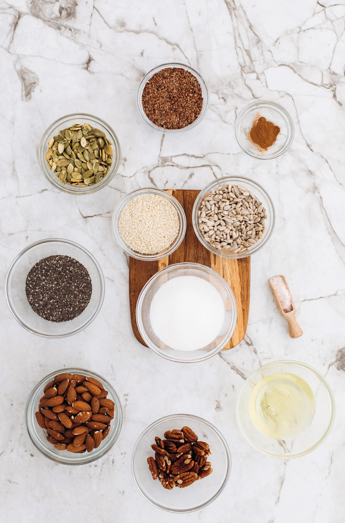 many bowls of spice for keto granola recipe on marble