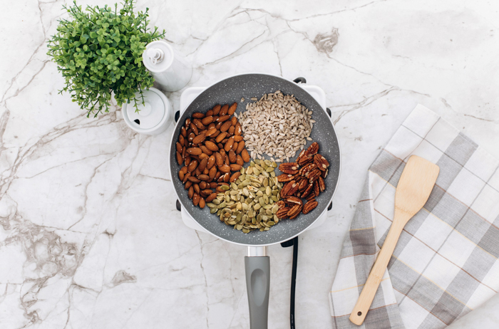 ingredients for keto granola separated in pan