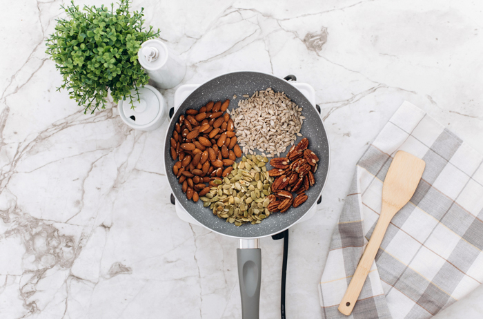 ingredients for keto granola separated in pan