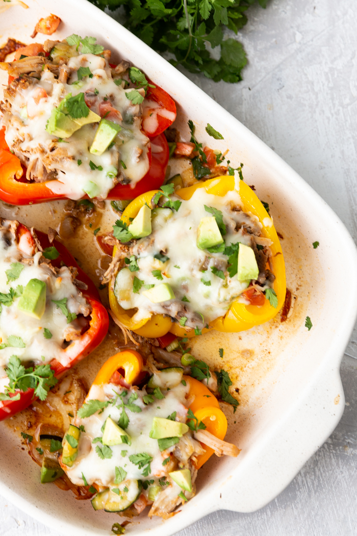 A baking dish filled with pork stuffed peppers