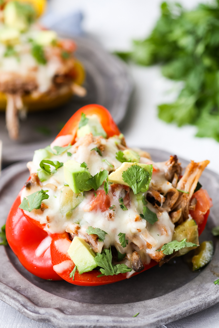 A plate with a close up of a pork stuffed peppers