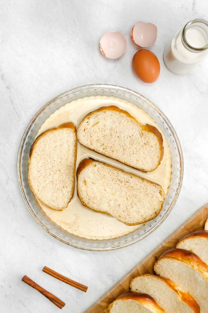 three slices of bread in a thick egg batter for french toast