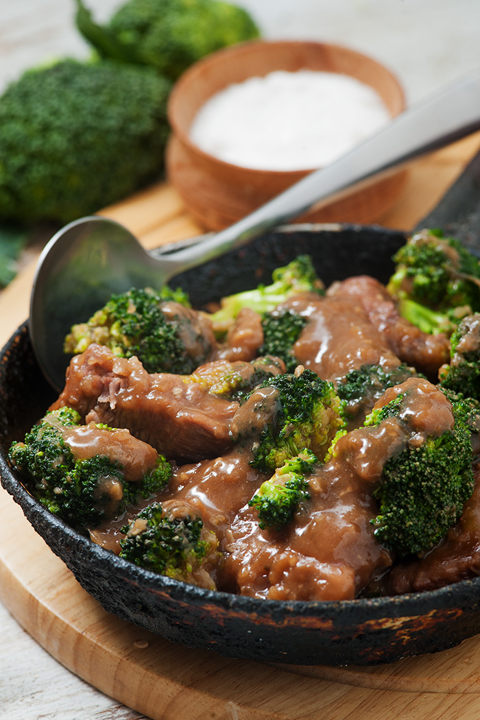 keto beef and brocc in a black bowl with a spoon