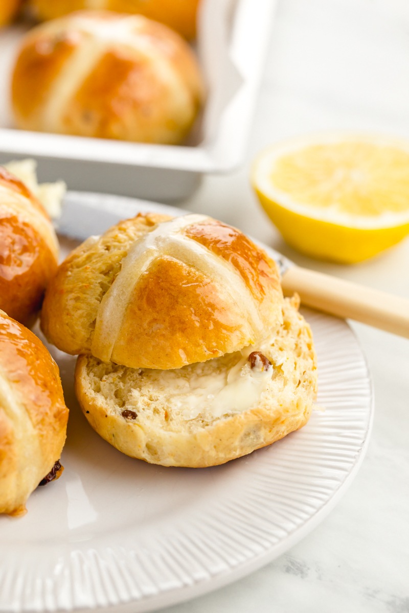 A few hot cross buns cut and slathered with butter