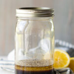 A jar filled with an all purpose marinade for chicken or pork