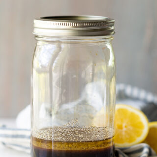 A jar filled with an all purpose marinade for chicken or pork