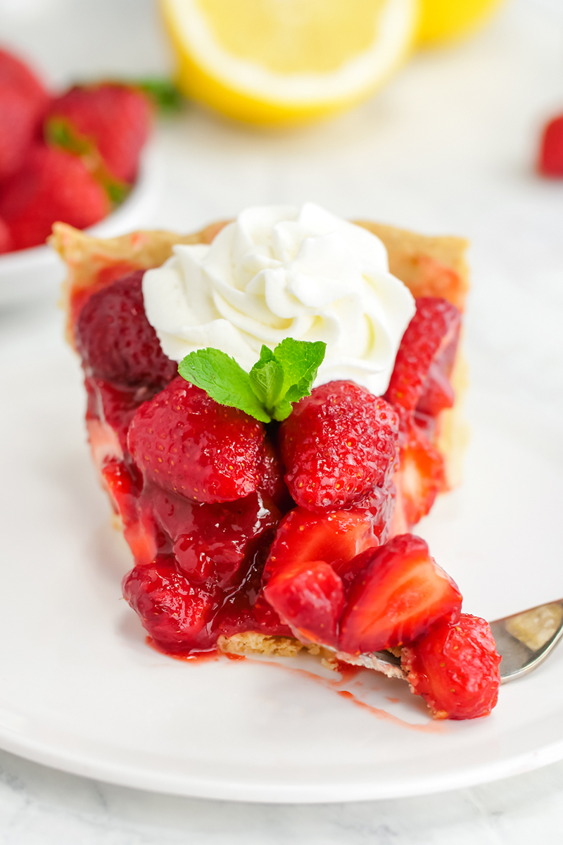 Strawberry pie with a bite taken out of it