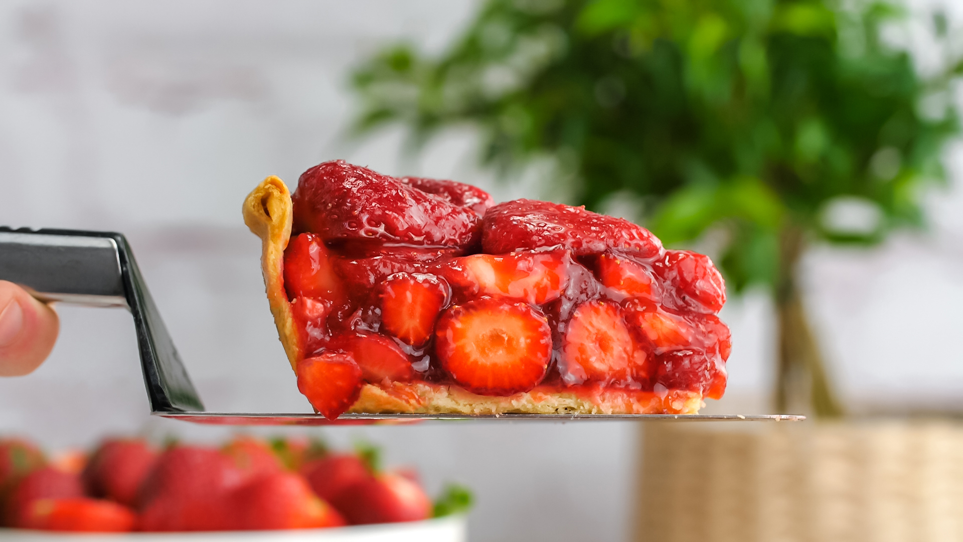 Strawberry Pie slice on a serving knife, side view of the fresh berries