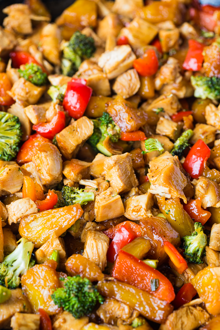 a close up of chicken teriyaki stir fry and vegetables
