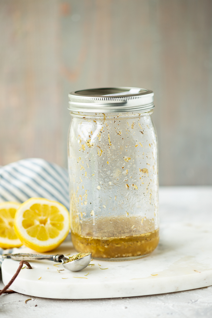 A jar of lemon rosemary marinade for chicken and pork